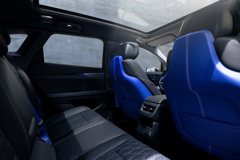 Back Seat View of the 2026 OPTIQ-V Blue Front Seats, Sun Roof, and Interior | Bergstrom Cadillac of Neenah in Neenah WI
