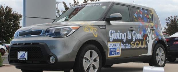 photo of a car with the words 'giving is good' on it