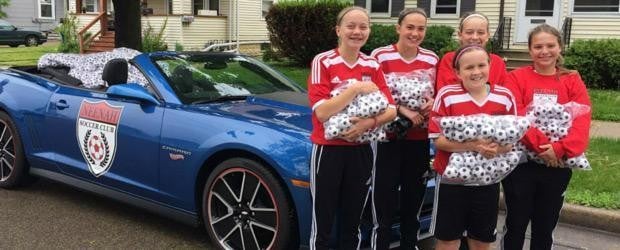 photo of a group of people holding a pillow