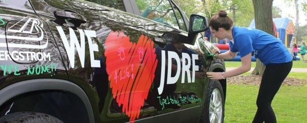 photo of a car with the words 'we love JDRF' on it